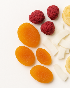 Assorted dried fruits and berries on a white background